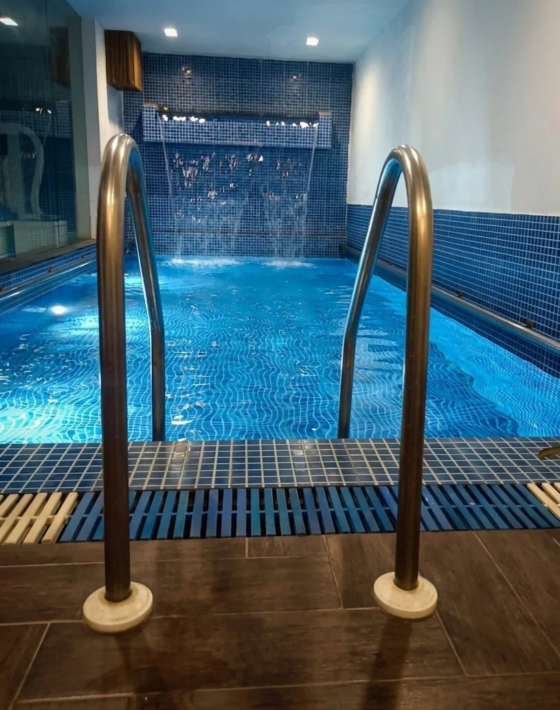 Indoor pool with integrated water wall — Faridabad, Haryana