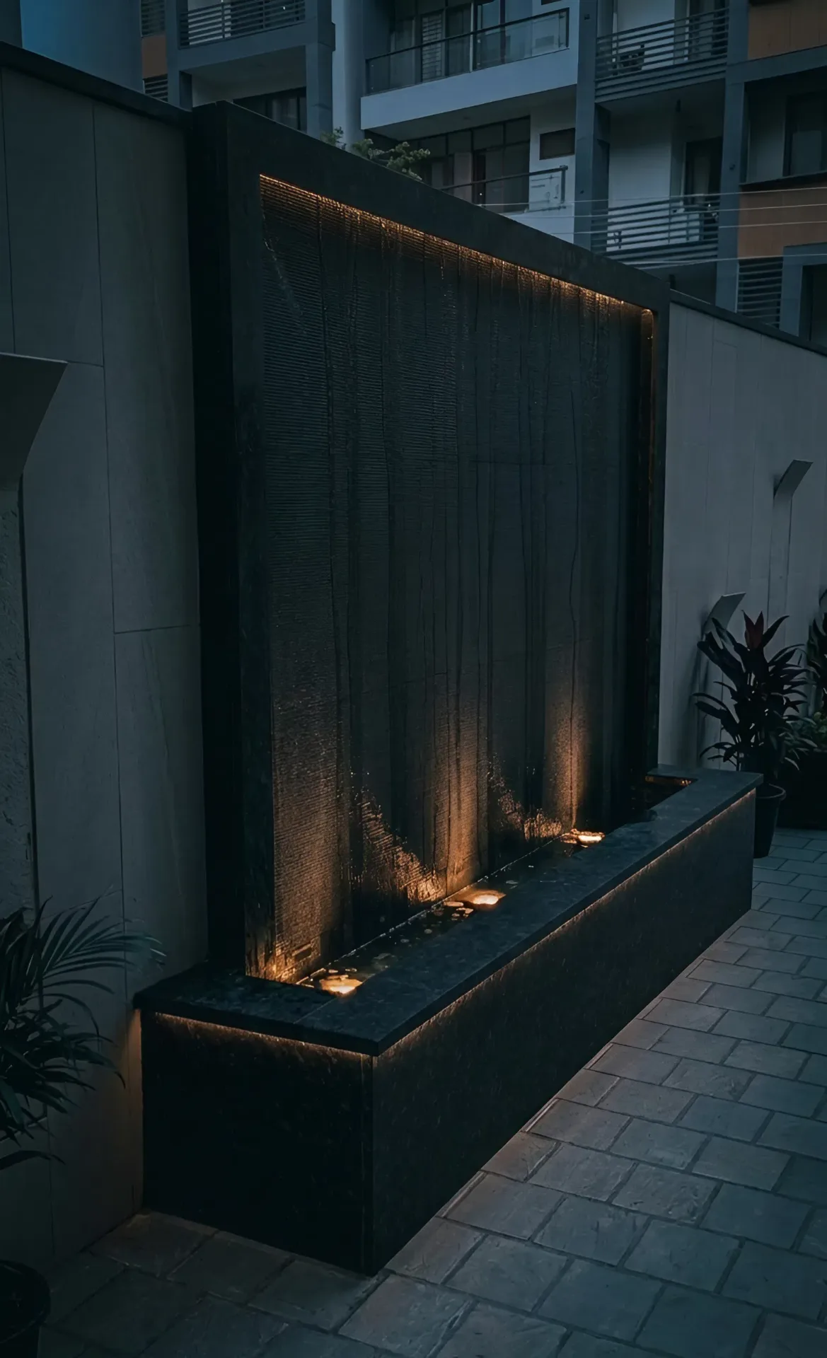 Outdoor curtain waterfall at night — Chattarpur Farms, Delhi