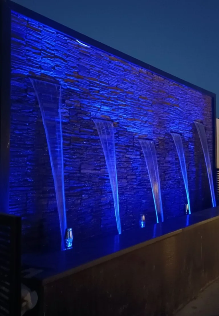 Illuminated blue waterfall wall — Mehrauli, New Delhi